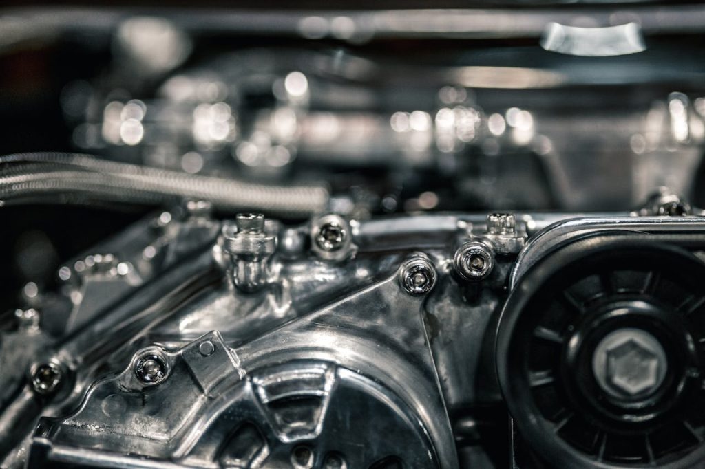 Detailed view of a shiny and modern automotive engine with metal components.